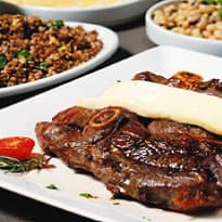 Bode assado na brasa