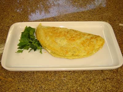 Panquecas de batatas com recheio de mussarela e presunto